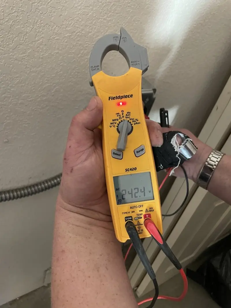 Voltage testing with clamp meter during Whole House Surge Protector in Crystal Springs